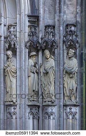 Figures of saints at the entrance portal of the Lamberti Church, Münster, North Rhine-Westphalia, Germany, Europe View Large Photo Image Picture - Figures of saints at the entrance portal of the Lamberti Church, Münster, North Rhine-Westphalia, Germany, Europe. Fotosearch