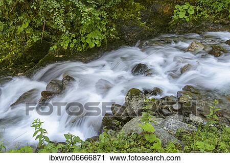 Flowing water at the Gartel waterfall in Hohe Tauern National Park, Austria, Europe View Large Photo Image Stock Image - Flowing water at the Gartel waterfall in Hohe Tauern National Park, Austria, Europe. Fotosearch