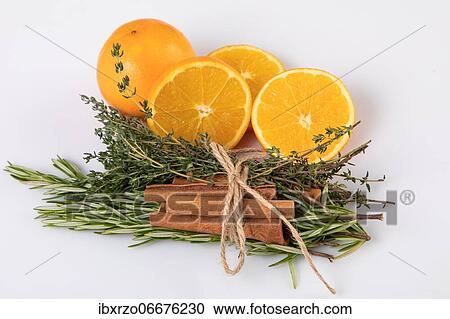 Fresh oranges with cinnamon sticks tied together with rosemary and thyme, white background View Large Photo Image Stock Image - Fresh oranges with cinnamon sticks tied together with rosemary and thyme, white background. Fotosearch