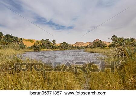 Fresh water lake as part of the the Unesco sight Ounianga lakes in the middle of the desert, northern Chad, Africa View Large Photo Image Stock Photo - Fresh water lake as part of the the Unesco sight Ounianga lakes in the middle of the desert, northern Chad, Africa. Fotosearch