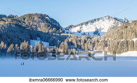 Frozen Spitzingsee in winter with walkers, in the back Schlierseer Berge with Brecherspitz, Spitzingsee, Schliersee, Bavaria, Germany, Europe View Large Photo Image Stock Image - Frozen Spitzingsee in winter with walkers, in the back Schlierseer Berge with Brecherspitz, Spitzingsee, Schliersee, Bavaria, Germany, Europe. Fotosearch