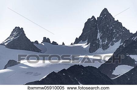Stock Photography - Glacier du Tour, Gifel jutting out of glacier, Mont Blanc Massif, Chamonix-Mont-Blanc, Haute-Savoie, France, Europe. Fotosearch