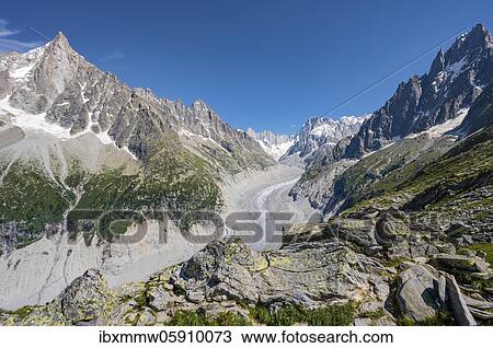 Stock Image - Glacier tongue Mer de Glace, rear Grandes Jorasses, Mont Blanc massif, Chamonix, France, Europe. Fotosearch