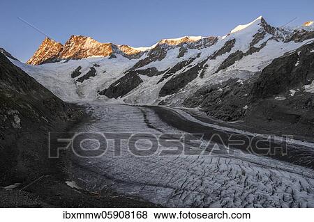Stock Photo - High alpine landscape, sunrise, glacier tongue, glacier Unteres Eismeer, Finsteraarhorn, Agasszishorn, Großes Fiescherhorn, Bernese Oberland, Switzerland, Europe. Fotosearch