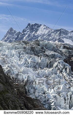 High alpine mountain landscape, Lower Arctic Ocean, Agassizhorn and Finsteraarhorn mountain peaks, glacier tongue, Bernese Oberland, Switzerland, Europe View Large Photo Image Stock Image - High alpine mountain landscape, Lower Arctic Ocean, Agassizhorn and Finsteraarhorn mountain peaks, glacier tongue, Bernese Oberland, Switzerland, Europe. Fotosearch