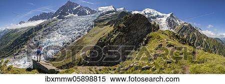 Hiker in front of glacier tongue, left Glacier des Bossons, right Glacier de Taconnaz, left summit of Aiguille du Midi, right Mont Blanc, Chamonix, Haute-Savoie, France, Europe View Large Photo Image Stock Photography - Hiker in front of glacier tongue, left Glacier des Bossons, right Glacier de Taconnaz, left summit of Aiguille du Midi, right Mont Blanc, Chamonix, Haute-Savoie, France, Europe. Fotosearch