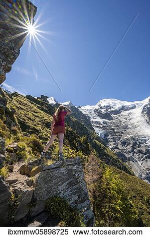 Hiker looking at glacier Glacier de Taconnaz, view from the hike La Jonction, Chamonix, Haute-Savoie, France, Europe View Large Photo Image Stock Photography - Hiker looking at glacier Glacier de Taconnaz, view from the hike La Jonction, Chamonix, Haute-Savoie, France, Europe. Fotosearch