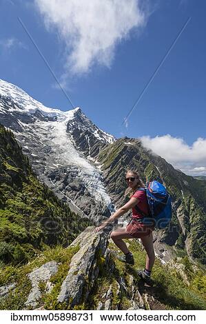 Hiker looking into the camera, mountain landscape, behind glacier Glacier de Taconnaz, hiking La Jonction, Chamonix, Haute-Savoie, France, Europe View Large Photo Image Stock Image - Hiker looking into the camera, mountain landscape, behind glacier Glacier de Taconnaz, hiking La Jonction, Chamonix, Haute-Savoie, France, Europe. Fotosearch