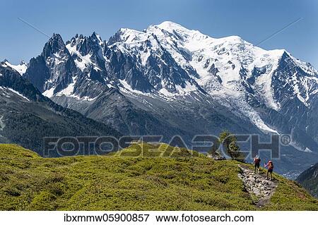 Hiker on hiking trail, mountain panorama from Aiguillette des Posettes, behind summit Aiguille du Midi and Mont Blanc, Chamonix, Haute-Savoie, Frankreic (Hiker) on hiking trail, mountain panorama from Aiguillette des Posettes, behind summit Aiguille... View Large Photo Image Stock Photo - Hiker on hiking trail, mountain panorama from Aiguillette des Posettes, behind summit Aiguille du Midi and Mont Blanc, Chamonix, Haute-Savoie, Frankreic (Hiker) on hiking trail, mountain panorama from Aiguillette des Posettes, behind summit Aiguille.... Fotosearch