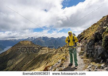 Hiker on Kepler Track, Great Walk, view of the South Fiord of Lake Te Anau, Murchison Mountains in the background, Fiordland National Park, Southland, New Zealand, Oceania View Large Photo Image Stock Image - Hiker on Kepler Track, Great Walk, view of the South Fiord of Lake Te Anau, Murchison Mountains in the background, Fiordland National Park, Southland, New Zealand, Oceania. Fotosearch