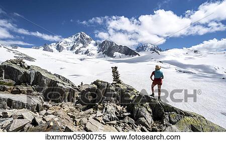 Hiker standing in front of glacier, Glacier du Tour, glacier and mountain peak, high alpine landscape, left Aiguille du Chardonnet, Chamonix, Haute-Savoie, France, Europe View Large Photo Image Stock Photography - Hiker standing in front of glacier, Glacier du Tour, glacier and mountain peak, high alpine landscape, left Aiguille du Chardonnet, Chamonix, Haute-Savoie, France, Europe. Fotosearch