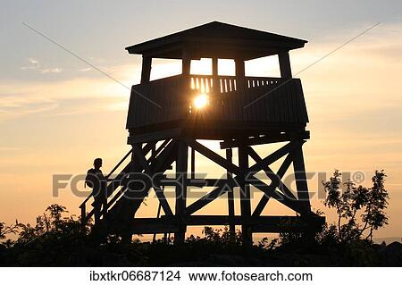 Hiking, woman at sunset at the stairs of a lookout tower, Tunturi, Salla, Finland, Europe View Large Photo Image Picture - Hiking, woman at sunset at the stairs of a lookout tower, Tunturi, Salla, Finland, Europe. Fotosearch