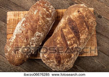 Home made fresh bread on wooden board View Large Photo Image Stock Photography - Home made fresh bread on wooden board. Fotosearch