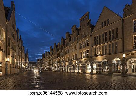 Illuminated historic gabled houses in the evening at blue hour, Prinzipalmarkt, Münster, North Rhine-Westphalia, Germany, Europe View Large Photo Image Stock Photo - Illuminated historic gabled houses in the evening at blue hour, Prinzipalmarkt, Münster, North Rhine-Westphalia, Germany, Europe. Fotosearch