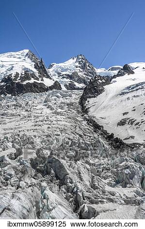Stock Photography - La Jonction, glacier tongue, Glacier des Bossons meets Glacier de Taconnaz, summit of Mont Maudit and Mont Blanc, Chamonix, Haute-Savoie, France, Europe. Fotosearch