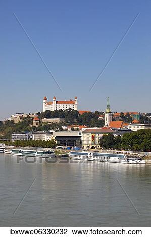 Landing stage for Danube cruise ships with a view to Bratislava Castle, Danube, Bratislava, Slovakia, Europe View Large Photo Image Stock Image - Landing stage for Danube cruise ships with a view to Bratislava Castle, Danube, Bratislava, Slovakia, Europe. Fotosearch