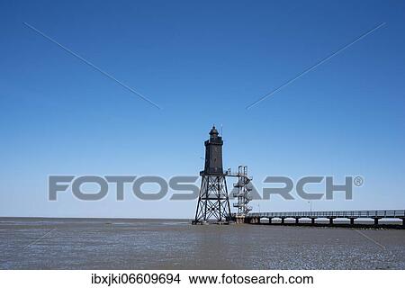 Picture - Lighthouse Obereversand, Dorum-Neufeld, Lower Saxony, Germany, Europe. Fotosearch