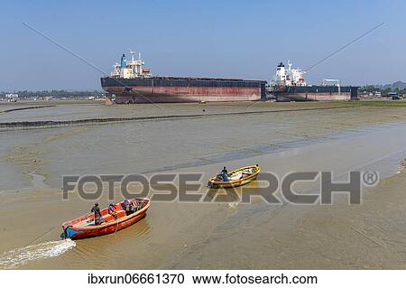 Little fishing boats in the low tide, Chittagong Ship Breaking Yard, Chittagong, Bangladesh, Asia View Large Photo Image Stock Image - Little fishing boats in the low tide, Chittagong Ship Breaking Yard, Chittagong, Bangladesh, Asia. Fotosearch
