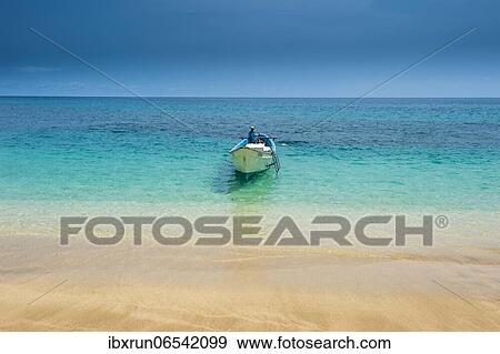 Little motorboat in the turquoise waters of Banana beach, Unesco biosphere reserve, Principe, Sao Tome and Principe, Atlantic Ocean, Africa View Large Photo Image Stock Photo - Little motorboat in the turquoise waters of Banana beach, Unesco biosphere reserve, Principe, Sao Tome and Principe, Atlantic Ocean, Africa. Fotosearch