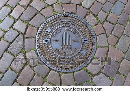 Manhole cover 1200 years City of Münster, Münster, North Rhine-Westphalia, Germany, Europe View Large Photo Image Stock Photo - Manhole cover 1200 years City of Münster, Münster, North Rhine-Westphalia, Germany, Europe. Fotosearch