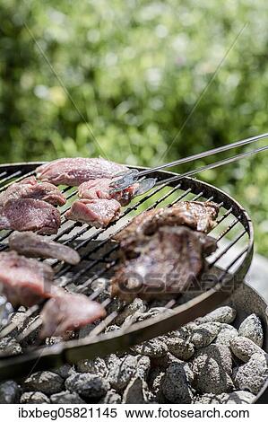 Stock Photography - Meat on grill. Fotosearch