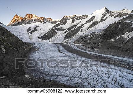 Stock Image - Mountain panorama, high alpine landscape, sunrise, glacier tongue, glacier Unteres Eismeer, Finsteraarhorn, Agasszishorn, Großes Fiescherhorn, Bernese Oberland, Switzerland, Europe. Fotosearch