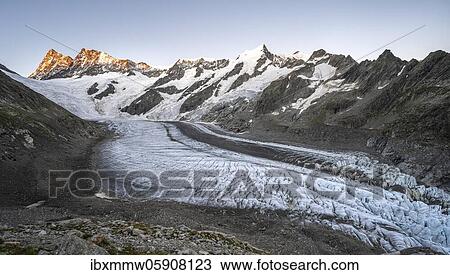 Stock Image - Mountain panorama, high alpine landscape, sunrise, glacier tongue, glacier Unteres Eismeer, Finsteraarhorn, Agasszishorn, Großes Fiescherhorn, Bernese Oberland, Switzerland, Europe. Fotosearch