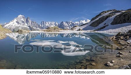 Mountain panorama, ice floe on Lac Blanc, mountain peaks reflected in mountain lake, Grandes Jorasses and Mont Blanc massif, Chamonix-Mont-Blanc, Haute-Savoie, France, Europe View Large Photo Image Stock Image - Mountain panorama, ice floe on Lac Blanc, mountain peaks reflected in mountain lake, Grandes Jorasses and Mont Blanc massif, Chamonix-Mont-Blanc, Haute-Savoie, France, Europe. Fotosearch