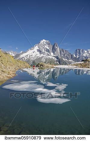 Mountain panorama, ice floe on Lac Blanc, mountain peaks reflected in mountain lake, Grandes Jorasses and Mont Blanc massif, Chamonix-Mont-Blanc, Haute-Savoie, France, Europe View Large Photo Image Stock Photo - Mountain panorama, ice floe on Lac Blanc, mountain peaks reflected in mountain lake, Grandes Jorasses and Mont Blanc massif, Chamonix-Mont-Blanc, Haute-Savoie, France, Europe. Fotosearch