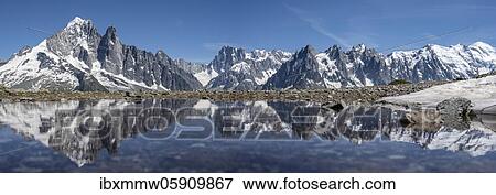 Stock Photo - Mountain panorama, reflection in Lac Blanc, mountain peaks, Grandes Jorasses and the Mont Blanc massif, Chamonix-Mont-Blanc, Haute-Savoie, France, Europe. Fotosearch