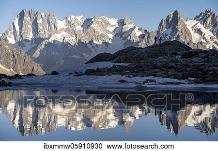 Mountain panorama with water reflection in Lac Blanc, Aiguille Verte, mountain peaks, Grandes Jorasses and the Mont Blanc massif, Chamonix-Mont-Blanc, Haute-Savoie, France, Europe View Large Photo Image Stock Image - Mountain panorama with water reflection in Lac Blanc, Aiguille Verte, mountain peaks, Grandes Jorasses and the Mont Blanc massif, Chamonix-Mont-Blanc, Haute-Savoie, France, Europe. Fotosearch