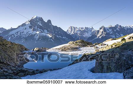 Mountain panorama with water reflection in Lac Blanc, mountain tops, Aiguille Verte, Grandes Jorasses, Aiguille du Moine, Mont Blanc, Mont Blanc massif, Chamonix-Mont-Blanc, Haute-Savoie, France, Europe View Large Photo Image Stock Photo - Mountain panorama with water reflection in Lac Blanc, mountain tops, Aiguille Verte, Grandes Jorasses, Aiguille du Moine, Mont Blanc, Mont Blanc massif, Chamonix-Mont-Blanc, Haute-Savoie, France, Europe. Fotosearch