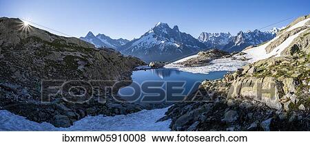 Mountain panorama with water reflection in Lac Blanc, mountain tops, Aiguille Verte, Grandes Jorasses, Aiguille du Moine, Mont Blanc, Mont Blanc massif, Chamonix-Mont-Blanc, Haute-Savoie, France, Europe View Large Photo Image Stock Photo - Mountain panorama with water reflection in Lac Blanc, mountain tops, Aiguille Verte, Grandes Jorasses, Aiguille du Moine, Mont Blanc, Mont Blanc massif, Chamonix-Mont-Blanc, Haute-Savoie, France, Europe. Fotosearch
