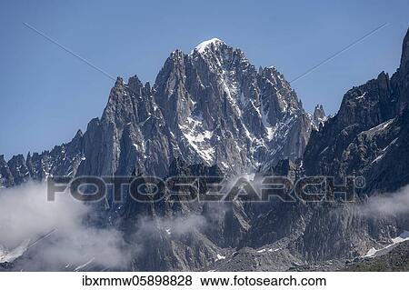 Mountain peak in clouds, Aiguille Verte, Chamonix, Haute-Savoie, France, Europe View Large Photo Image Stock Photo - Mountain peak in clouds, Aiguille Verte, Chamonix, Haute-Savoie, France, Europe. Fotosearch