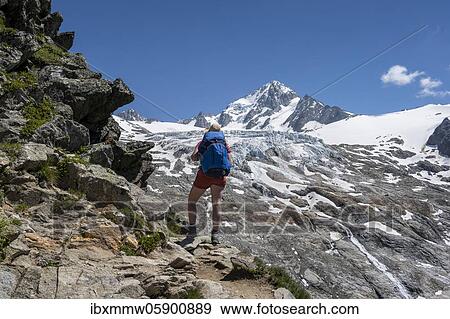 Stock Photo - Mountaineer, Hiker on the way to the Refuge Albert 1er, Glacier du Tour, Glacier and mountain peaks, High alpine landscape, Peak of the Aiguille de Chardonnet, Chamonix, Haute-Savoie, France, Europe. Fotosearch