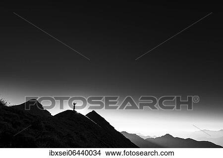 Mountaineer on summit ridge with backlight, in the background Ammergau Alps, Reutte, Ammergau Alps, Tyrol, Austria, Europe View Large Photo Image Picture - Mountaineer on summit ridge with backlight, in the background Ammergau Alps, Reutte, Ammergau Alps, Tyrol, Austria, Europe. Fotosearch