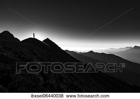 Mountaineer on summit ridge with backlight, in the background Ammergau Alps, Reutte, Ammergau Alps, Tyrol, Austria, Europe View Large Photo Image Stock Photo - Mountaineer on summit ridge with backlight, in the background Ammergau Alps, Reutte, Ammergau Alps, Tyrol, Austria, Europe. Fotosearch