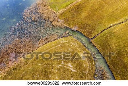 Natural course of the Zellerache river from the Irrsee, wet meadow, from above, drone photo, aerial view, Mondseeland, Salzkammergut, Upper Austria, Austria, Europe View Large Photo Image Stock Image - Natural course of the Zellerache river from the Irrsee, wet meadow, from above, drone photo, aerial view, Mondseeland, Salzkammergut, Upper Austria, Austria, Europe. Fotosearch