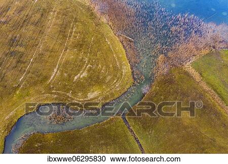Natural course of the Zellerache river from the Irrsee, wet meadow, from above, drone photo, aerial view, Mondseeland, Salzkammergut, Upper Austria, Austria, Europe View Large Photo Image Stock Image - Natural course of the Zellerache river from the Irrsee, wet meadow, from above, drone photo, aerial view, Mondseeland, Salzkammergut, Upper Austria, Austria, Europe. Fotosearch