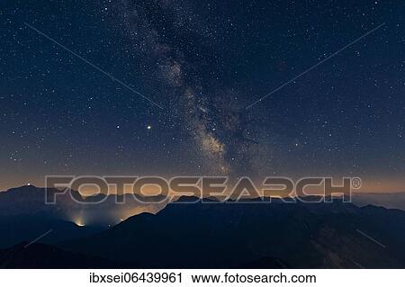 Night sky with stars and milky way over Lechtal mountains, Reutte, Ammergau Alps, Tyrol, Austria, Europe View Large Photo Image Stock Image - Night sky with stars and milky way over Lechtal mountains, Reutte, Ammergau Alps, Tyrol, Austria, Europe. Fotosearch