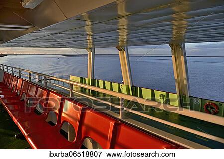 North Sea ferry, covered outside deck with red seating, North Sea, North Sea coast, Norddeich, Lower Saxony, Germany, Europe View Large Photo Image Stock Photo - North Sea ferry, covered outside deck with red seating, North Sea, North Sea coast, Norddeich, Lower Saxony, Germany, Europe. Fotosearch