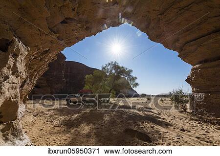 Off-road vehicle under rock arch, Ennedi plateau, Chad, Africa View Large Photo Image Stock Image - Off-road vehicle under rock arch, Ennedi plateau, Chad, Africa. Fotosearch