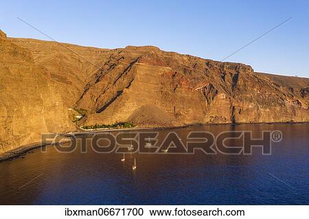 Playa de Argaga and Barranco de Argaga in the evening light, Valle Gran Rey, drone shot, La Gomera, Canary Islands, Spain, Europe View Large Photo Image Stock Image - Playa de Argaga and Barranco de Argaga in the evening light, Valle Gran Rey, drone shot, La Gomera, Canary Islands, Spain, Europe. Fotosearch