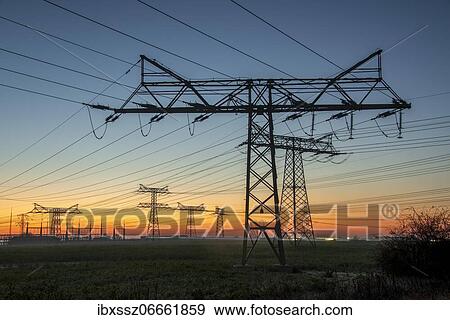 Power poles at sunrise, Wolmirstedt, Saxony-Anhalt, Germany, Europe View Large Photo Image Stock Photo - Power poles at sunrise, Wolmirstedt, Saxony-Anhalt, Germany, Europe. Fotosearch