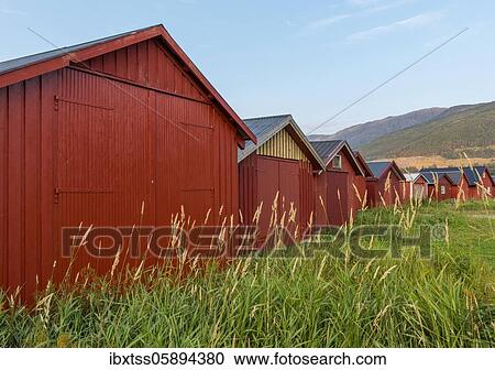 Stock Image - Red boathouses, Norway, Europe. Fotosearch