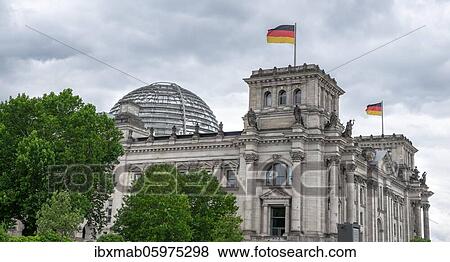 Reichstag building with waving German flag, government quarter, Berlin, Germany, Europe View Large Photo Image Stock Photo - Reichstag building with waving German flag, government quarter, Berlin, Germany, Europe. Fotosearch