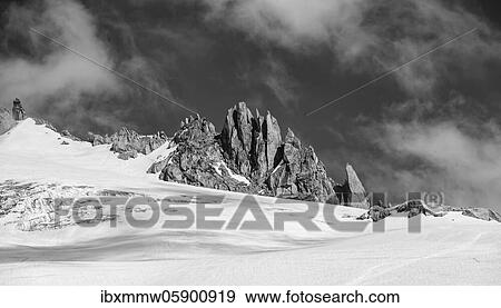 Stock Photo - Rocky peaks rising out of the snow cover, Glacier du Tour, glaciers and mountain peaks, high alpine landscape, Chamonix, Haute-Savoie, France, Europe. Fotosearch