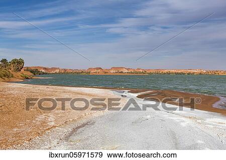 Salt crust at the shores of Ounianga kebir part of the the Unesco sight Ounianga lakes, northern Chad, Africa View Large Photo Image Stock Photo - Salt crust at the shores of Ounianga kebir part of the the Unesco sight Ounianga lakes, northern Chad, Africa. Fotosearch