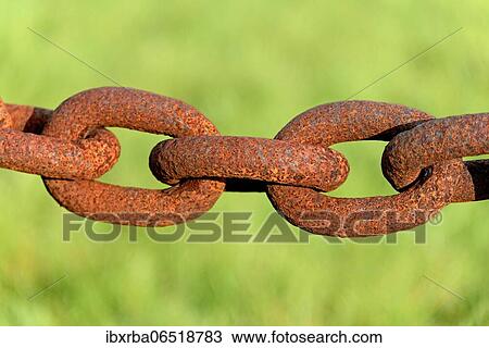Stock Image - Several rusty chain links, iron chain, close-up, symbolic picture, Greetsiel, Lower Saxony, Germany, Europe. Fotosearch