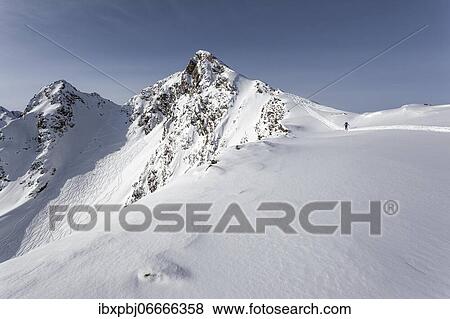 Ski tourer with ascent track, Zischgeles, Stubai Alps, Tyrol, Austria, Europe View Large Photo Image Stock Photo - Ski tourer with ascent track, Zischgeles, Stubai Alps, Tyrol, Austria, Europe. Fotosearch